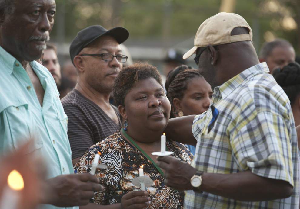 Photos: Citizens, officers mourn together at candlelight vigil in Sunset _lowres