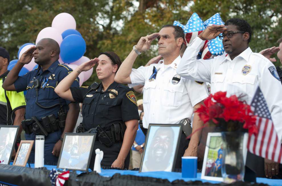 Photos: Citizens, officers mourn together at candlelight vigil in Sunset _lowres