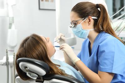FILE - Dentist dental therapy therapist