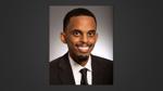 Headshot of Minnesota Sen. Omar Fateh wearing a suit and tie against a neutral background
