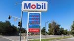 Gas price sign at a Mobil station in Simi Valley, California, showing prices above $5 per gallon.