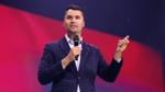 Charlie Kirk speaking on stage at the 2025 Student Action Summit in Tampa