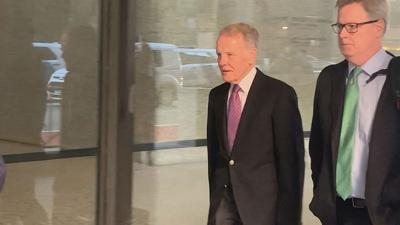 Michael Madigan arrives at the federal court building in Chicago.