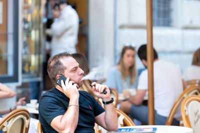 FILE - man vaping, vape, Juul, e-cigarette