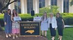 Prisha Mosley, second from left, stands with others outside the North Carolina Legislative Building.