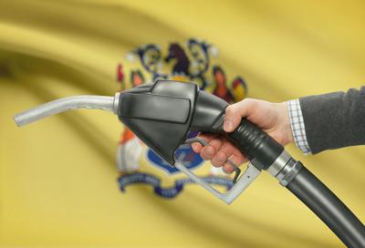 Gas prices New Jersey flag fuel nozzle