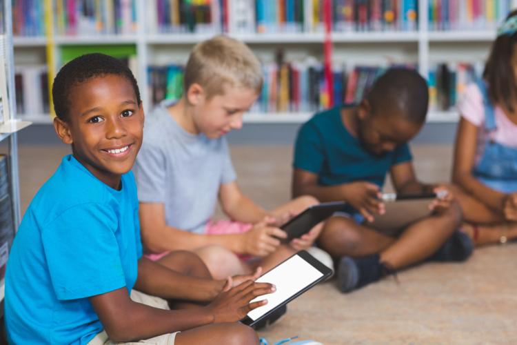 FILE - School Children Classroom Digital Tablet Technology