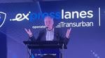 Sen. Tim Kaine speaks at event with Express Lanes backdrop