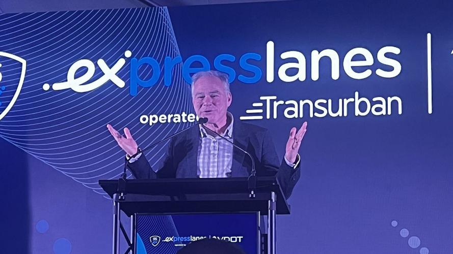 Sen. Tim Kaine speaks at event with Express Lanes backdrop