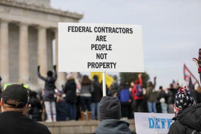 FILE - Mandates Vaccines Protest Federal Contractors