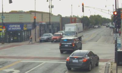 TCS - A screenshot of surveillance video gathered by CWB Chicago showing a mayoral motorcade vehicle running a red light