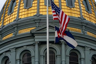 FILE - Colorado State Capitol Dome Flags