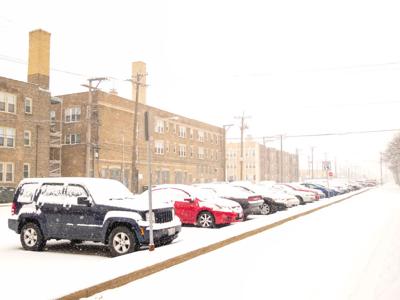 FILE - Winter, Snow, Cars
