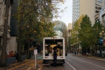 FILE – Unloading package downtown Seattle