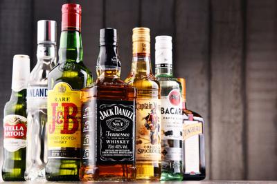 FILE - Distilled spirits hard alcohol whiskey rum vodka gin