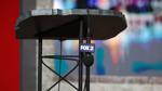 An empty podium for Mike Rogers at a FOX 2 U.S. Senate debate in Detroit.