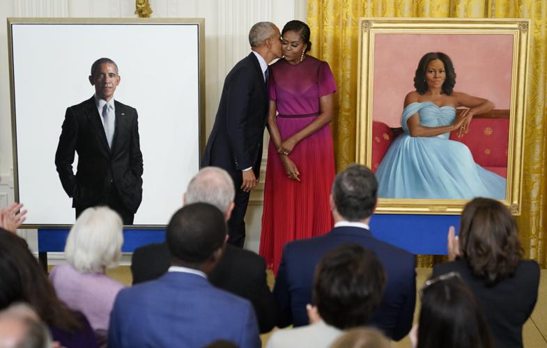 FILE - Michelle Obama, Biden Obama Portraits