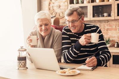 Retirement Retiree Senior Couple Laptop Kitchen Coffee
