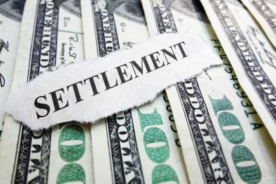 FILE - Settlement Money Lawsuit Litigation
