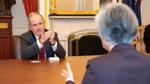 Jim Risch meets with Kang Kyung-wha during a meeting at a table.