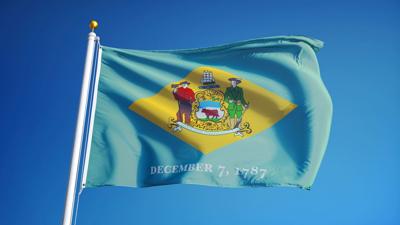 Delaware,(u.s.,State),Flag,Waving,Against,Clear,Blue,Sky,,Close
