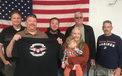 Members of the Blue Knights motorcycle club join LaNeen and Matt Smith in support of 2-year-old Sam.
