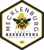 Mecklenburg County Beekeepers Association registering people for Bee School