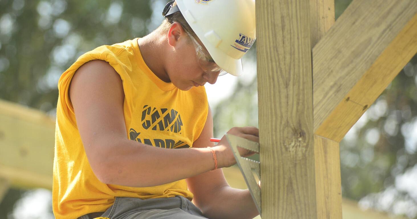 (WATCH) Help from Hard Hats: Kids spend week getting a pavilion project underway - Vimarsana News