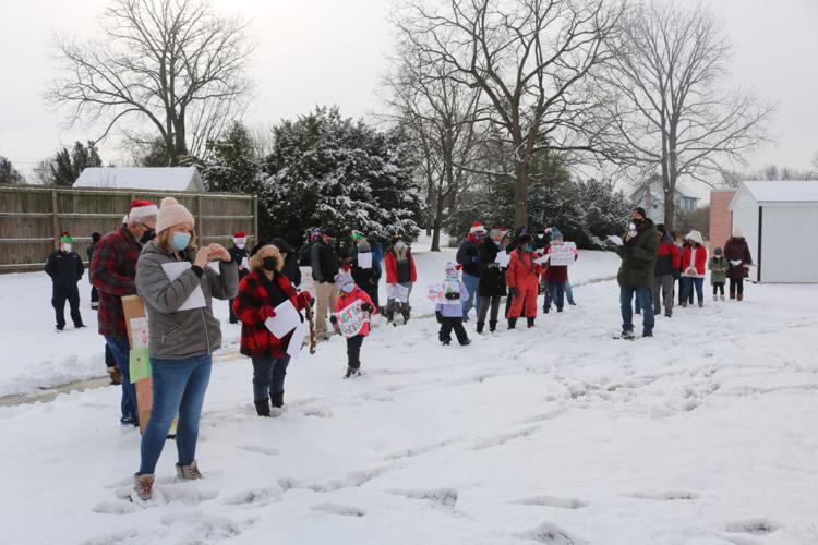 Carolers bring LeRoy Village Green residents an early Christmas gift