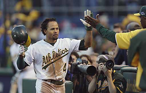 Oakland Athletics' Yoenis Cespedes high-fives Oakland Athletics