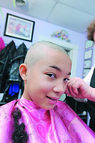 Albion barber cuts hair, supports children in community