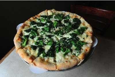 Signature Dish: Give me a Q! White pizza tops at Big Pauly’s