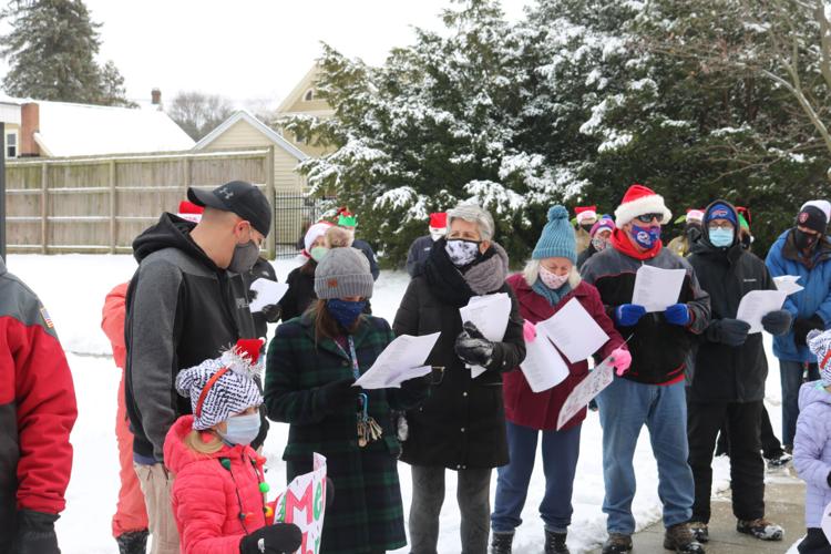 Carolers bring LeRoy Village Green residents an early Christmas gift