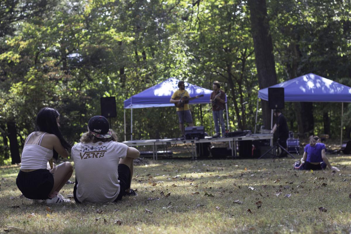 Two people enjoy the live entertainment at the festival.