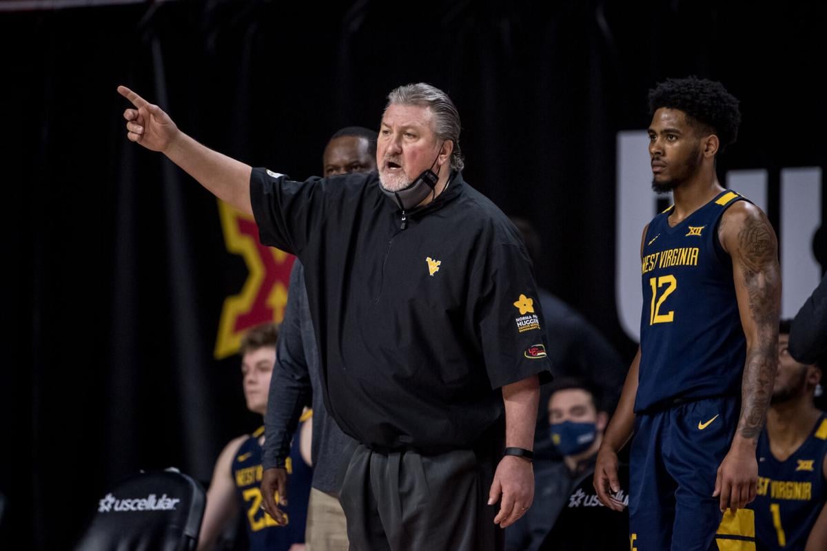 West Virginia head coach Bob Huggins directs the Mountaineers during West Virginia's game against Iowa State in Ames, Iowa, on Feb. 2, 2021.