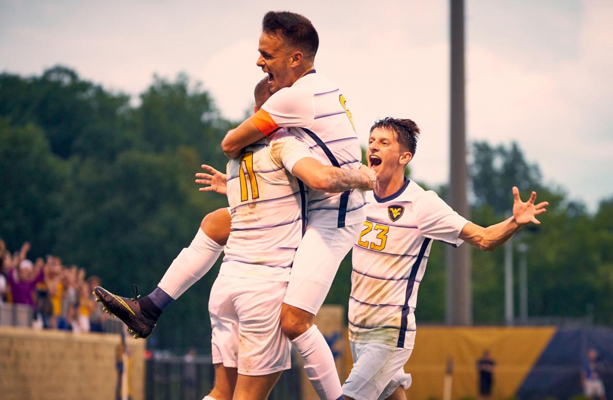 The West Virginia men's soccer team celebrates after defeating the No. 3 Pittsburgh Panthers on Aug. 30, 2021, in Morgantown, W.Va. 