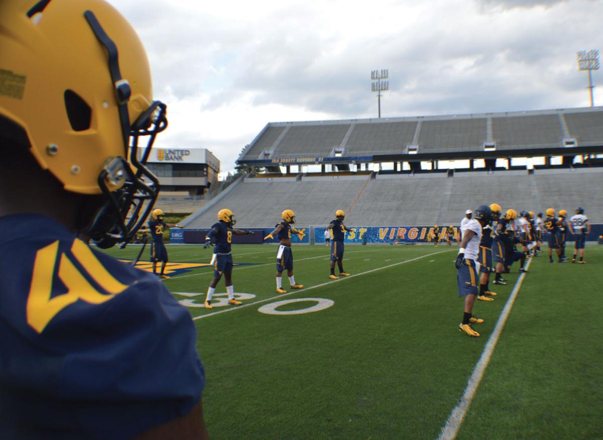 West Virginia opens 2015 football camp Monday Sports