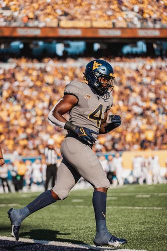 West Virginia running back Leddie Brown trots off the field against Long Island at Milan Puskar Stadium in Morgantown, W. Va., on Sept. 11, 2021. 
