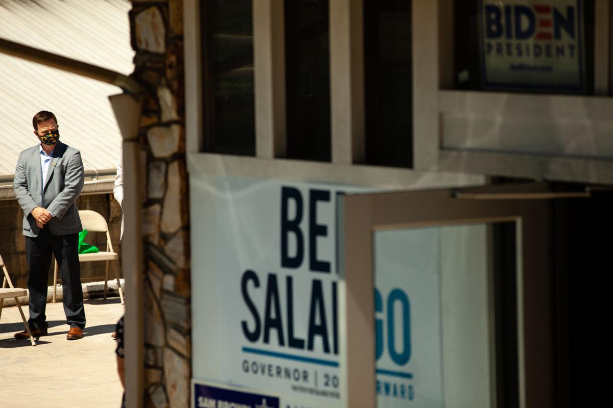 Democratic gubernatorial candidate Ben Salango stands and listens to other speakers at the ribbon cutting ceremony for his campaign's Morgantown field office on August 19, 2020.