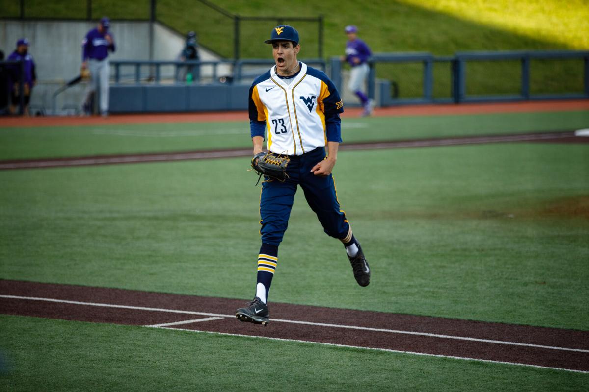 Pitcher Jackson Wolf celebrates during West Virginia's game against the TCU Horned Frogs on April 30, 2021.