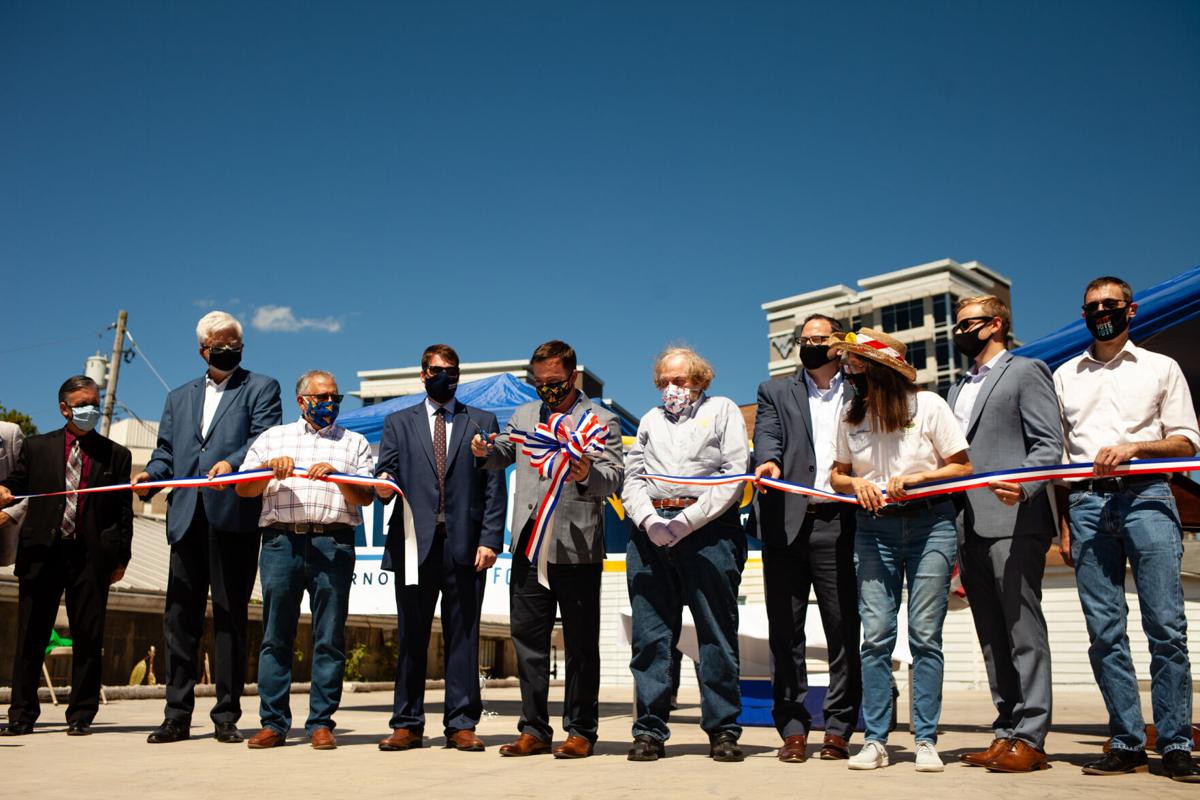 Democratic gubernatorial candidate Ben Salango with other elected officials and candidates cut a ribbon at a ceremony for his campaign's Morgantown field office on August 19, 2020 .