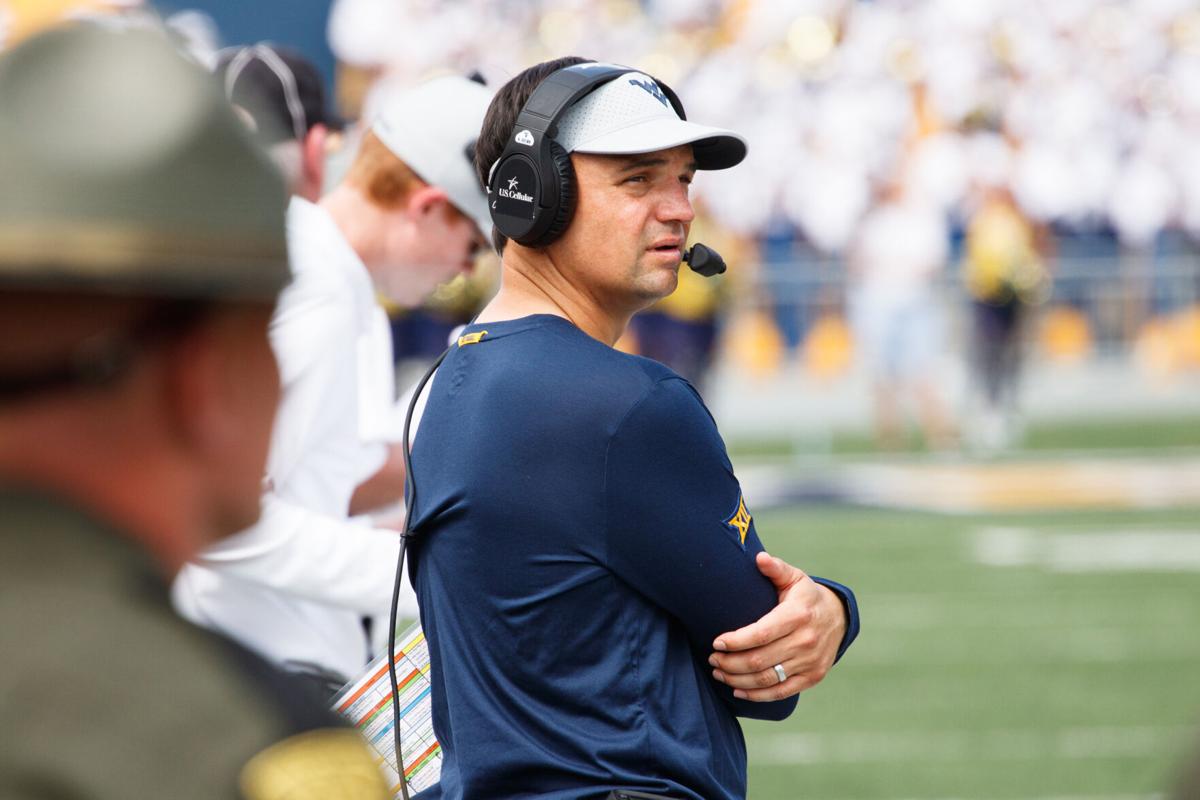 Neal Brown scans the field against NC State in 2019.