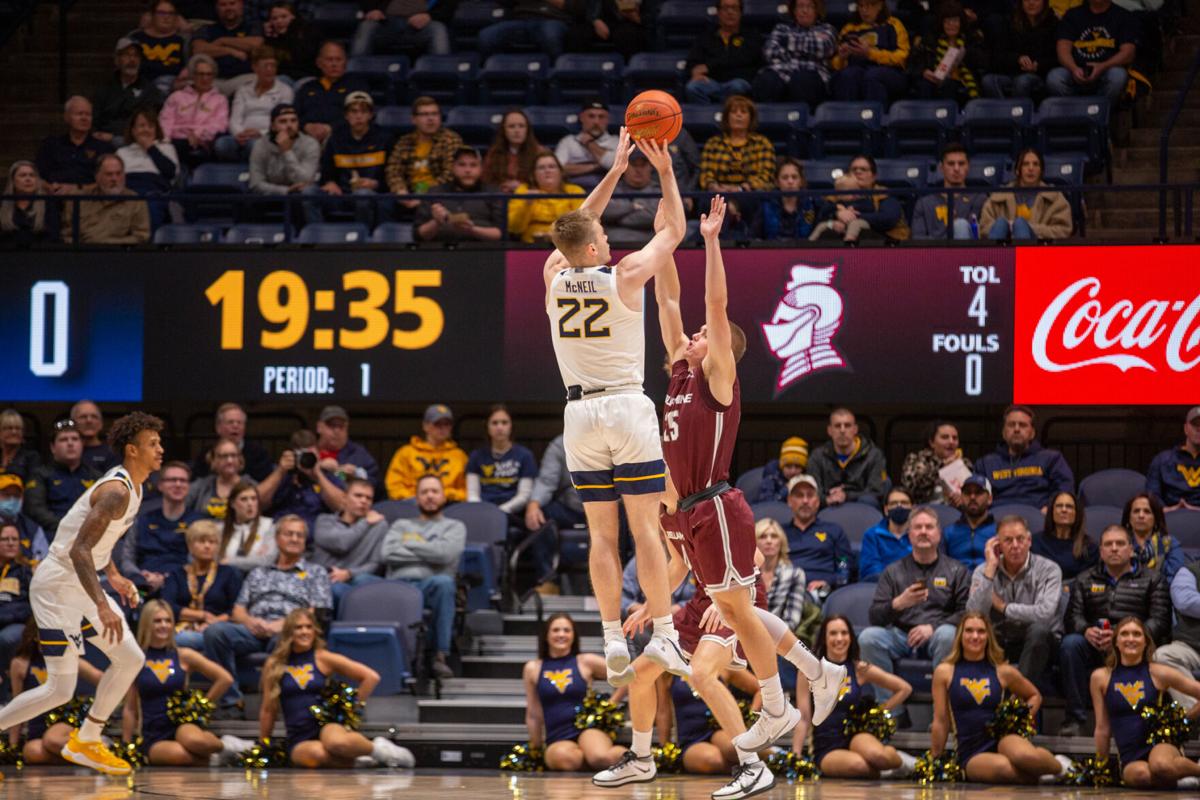 Sean McNeil (22) shoots during a game against Bellarmine on Nov. 30, 2021, from the WVU Coliseum in Morgantown, W.Va.