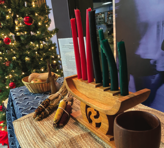 A Kinara in the Rhododendron room is on display for Kwanza.