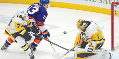 Pens steal win from Isles