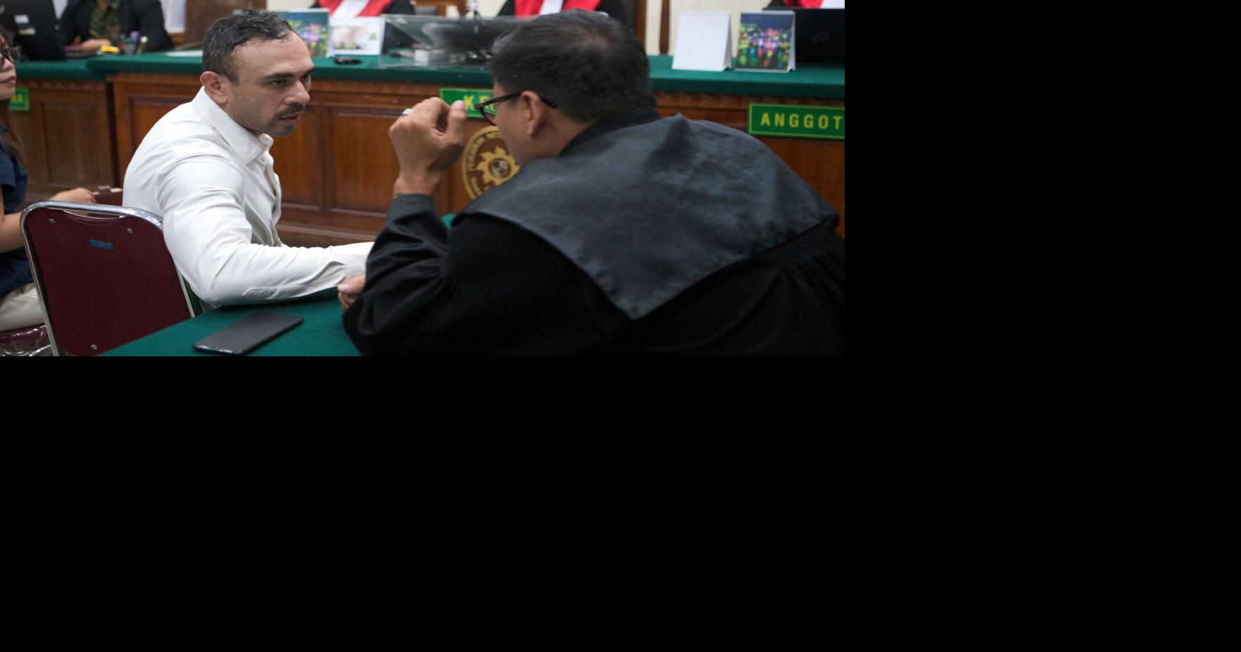 Indonesian court sentences an Australian to 12 years in prison for smuggling cocaine to Bali