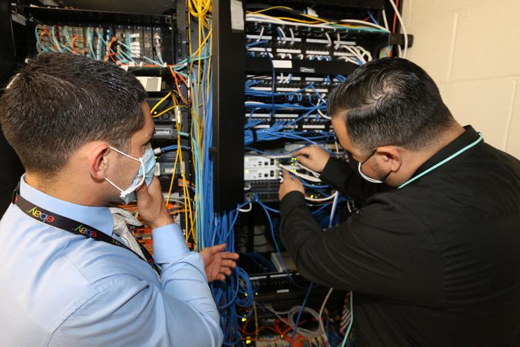 IVC Employees Connecting Equipment