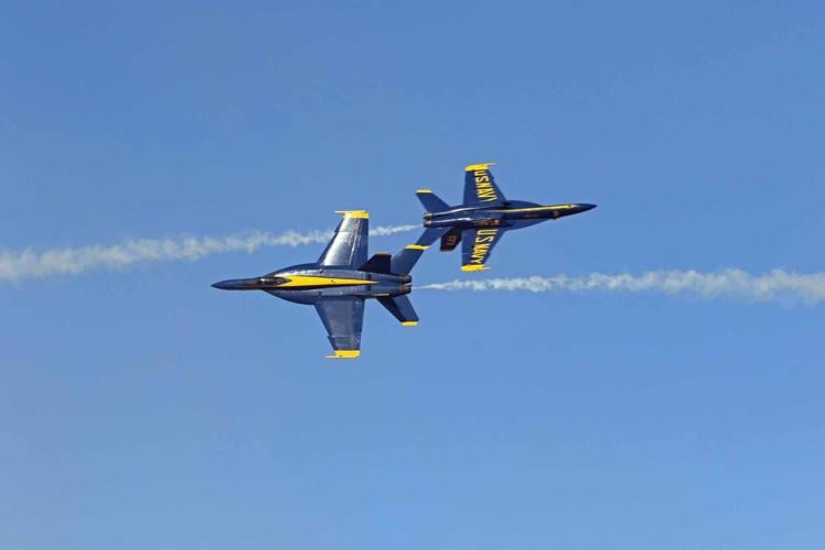 U.S. Navy Blue Angels - The Blue Angels jet pilots -- wearing throwback  gold flight suits -- commence their pre-flight walkdown at the first Blue  Angel flight demonstration of the 2014 air