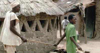 African with River Blindness Guided by Child - Getty Images