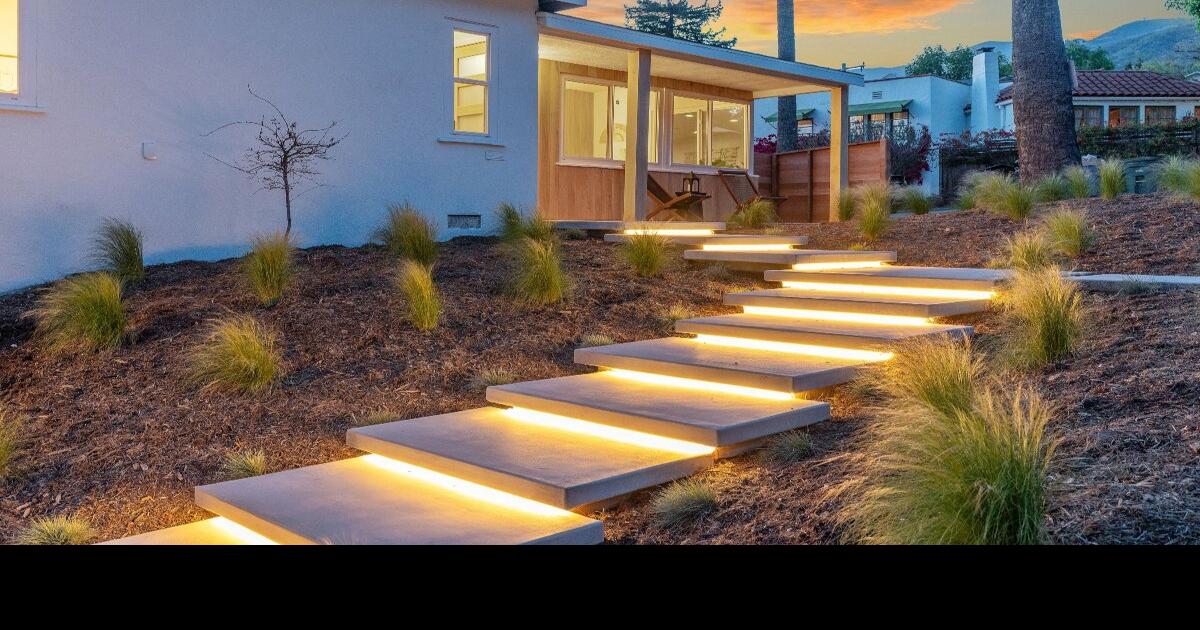 Lighted floating steps leading up to a house | Sponsored ...